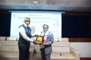 Dr. Vijay K Mittal, Associate Director of Medical Education, USA being felicitated by Padma Shri Dr Sarbeswar Sahariah Pro VC USTM