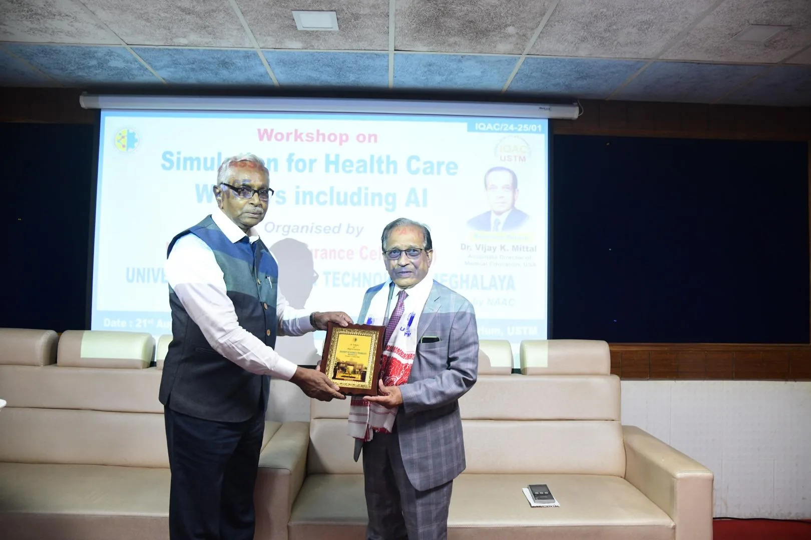 Dr. Vijay K Mittal, Associate Director of Medical Education, USA being felicitated by Padma Shri Dr Sarbeswar Sahariah Pro VC USTM